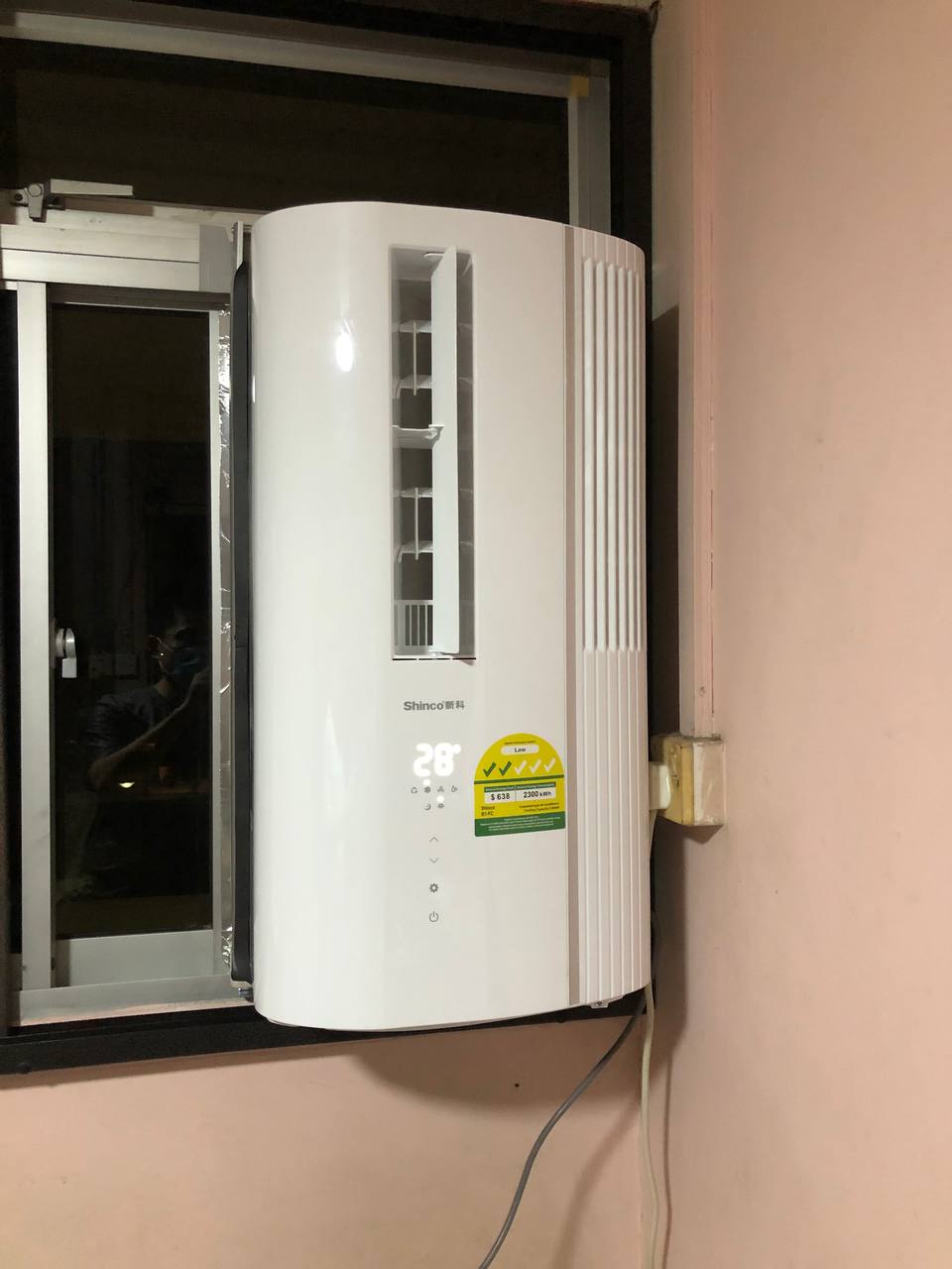 Shinco casement at night in an HDB flat