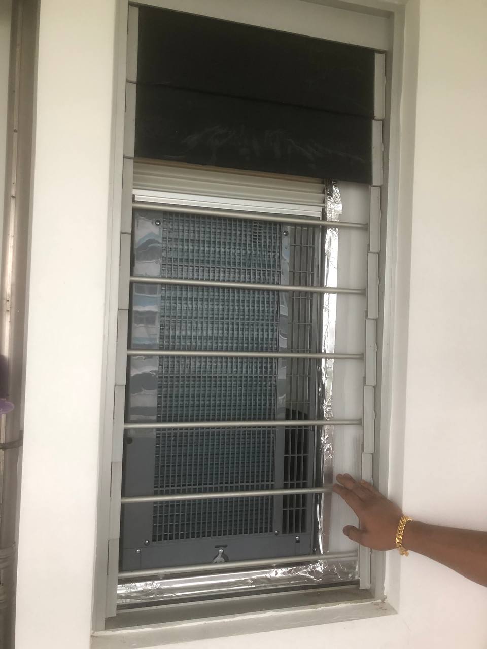 Outdoor view — fully installed casement from outside, sealed with aluminium tape