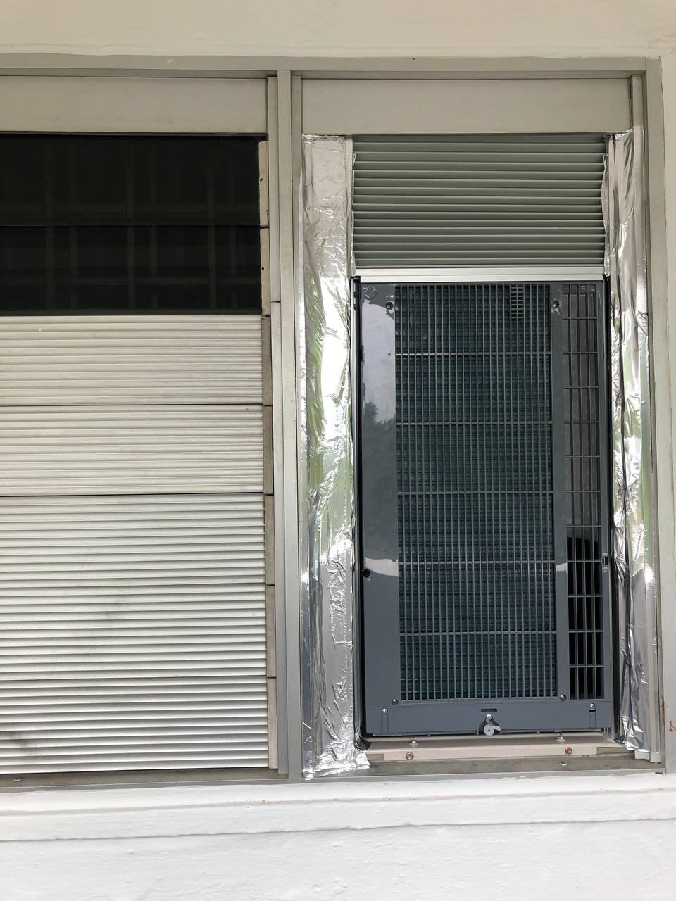 Narrow window frame installation — proves the 80 cm / 47 cm fit